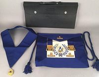 Grand Master Mason regalia items displayed outside the furnished carrying case.