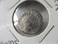 Close-up photograph of the obverse side of the silver denarius showing the portrait of Septimius Severus with surrounding legend.