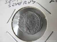 Front side of the silver Roman denarius showing Emperor Septimus Severus's profile with inscriptions.