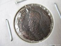 Obverse side of historic Roman coin showing Emperor Julian II's profile.