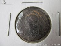 Front view of the Ancient Roman coin housed in a 2x2 coin holder with visible wear.