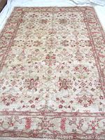 Full view of the vintage Persian Chobi rug showing the floral design and border, laid flat on white background.