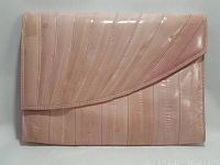 Front view of the soft pink eel skin handcrafted purse showing glossy finish and diagonal flap.