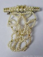 Pearl and gold-tone beaded hair barrette with detailed view of bead strands