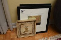 Three wall decor items: two framed Tom Thomson prints with black frames and white matting, and one smaller Sheer Glamour wood wall decor with beige polka-dot background and vintage perfume bottle illustration