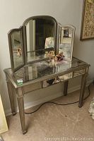 Front view of vanity desk with tri-fold mirror open showing overall condition
