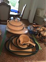 Royal Doulton white serving dishes including soup tureen with cracked lid handle, large platter, and vegetable dish.