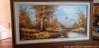 Landscape painting titled 'Cabin near mountains' by Patrick, 31x55 canvas with scenic autumn scene, canvas detached from frame but intact.