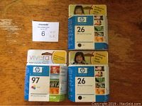 Top view showing all three HP ink cartridge boxes with front and side labels visible.