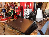NetGear router R7000P placed on countertop with antennas and power cable.