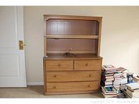 Full view of Thomasville dresser with detachable two-shelf hutch, light brown wood, next to a stack of books. Shows overall condition and size.