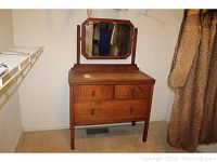 Full view of the antique solid oak dresser with three drawers and detachable swivel mirror attached, showing the style and height.