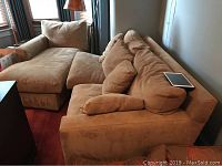 Angled view of both sofa sections assembled in room