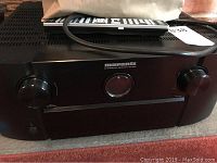 Front view of Marantz SR7008 receiver showing control knobs and display