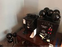 Orb Audio Super Eight subwoofer (right) and Orb Audio subMINI subwoofer (left) with Mini T on top, plus a few satellite speakers