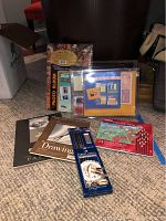 Photo of all items included in the lot arranged on carpet: pastel pencils, graphite pencils, pads, album, scrapbook kit