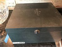 Closed black presentation box with Waterford Crystal branding on the lid.