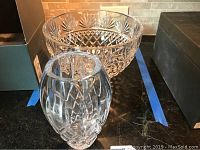 Photo of Waterford crystal vase and serving bowl side by side showing cut crystal pattern and clarity