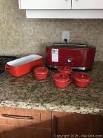Full view of KitchenAid toaster, Dansk loaf pan, and four Pier 1 ramekins arranged on countertop