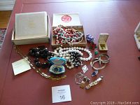 Overall display of all jewelry and photo album on table