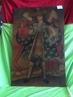Full view of large oil painting depicting an angel with wings holding a flute-like instrument, dressed in detailed traditional attire.