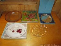 Full view of lot showing all plates and serving trays including the silver plated tray in box