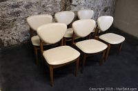 Angled front-left view of all six chairs grouped together
