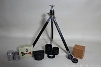 Full lot showing Leica lens parts, Wray loupe with box and cap, German tripod