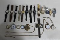 Overview photo showing all men's watches in the lot, including wristwatches with various bands and pocket watches with chains.