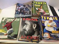 Photo showing assorted tennis magazines with covers featuring Jennifer Capriati, Andre Agassi, Roger Federer, and other players, various publication titles visible.