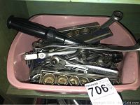 Pink plastic container filled with various Craftsman wrench and socket tools including ratchets and socket sets.