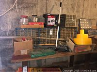 Overview of workbench with multiple fastener storage units, boxes, and tools.
