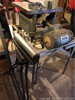 Craftsman table saw profile showing metal work surface and motor assembly