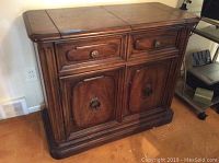 Full view of Henredon wooden server cabinet showing drawers and cabinet doors, wood finish, minor scratches on top.