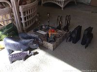 Full lot overview showing carved animals, candlesticks, bookends, and Chinese cork cutout in frame