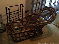 Overview photo showing the rattan chaise lounge and wooden quilt rack side by side in a room near window and door.