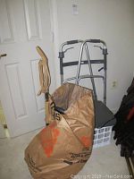 Drive deluxe folding walker with 5 inch wheels, braided bag, and small accessories in front