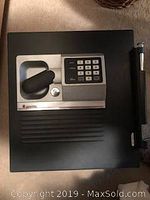 Front view of safe door showing keypad and handle detached from safe body