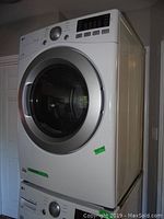 Stacked washer and dryer, dryer on top, right-front angle
