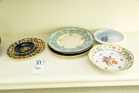 Overview of all plates arranged on a white surface showing variety of patterns and colors