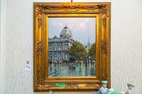 Full view of framed oil painting showing street scene in ornate gold frame