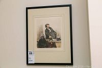 Framed pen and ink drawing, displayed on a wall, showing the full piece including frame and label.