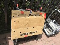 Top view of the Black & Decker Workmate 425 wooden work surface with clamp holes and branding visible.