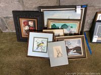 View of all seven artworks stacked showing frames and sizes