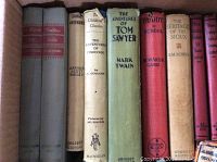 Carton open showing a range of vintage hardcovers including Pinocchio, Tom Sawyer, Buddy in School, The Heritage of the Sioux