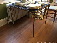 Folding card table full view showing size and condition with no contents.