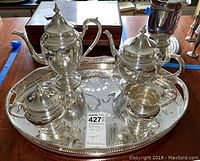 Full view of sterling silver tea service on oval tray
