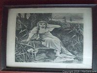 Full view of framed black and white painting showing the seated woman in a natural setting with tall grasses.