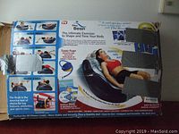 Box showing product information, benefits, and images of exerciser including instruction DVD and turbo pump.