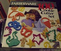 Box of Farberware 100 piece cookie cutter set showing various shapes and branding